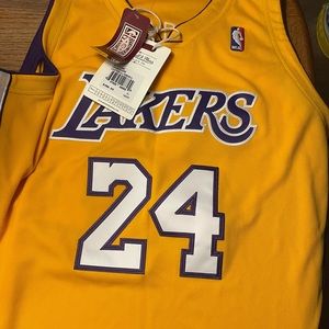 Brand new never worn lakers jersey Bryant size XL asking 250 obo